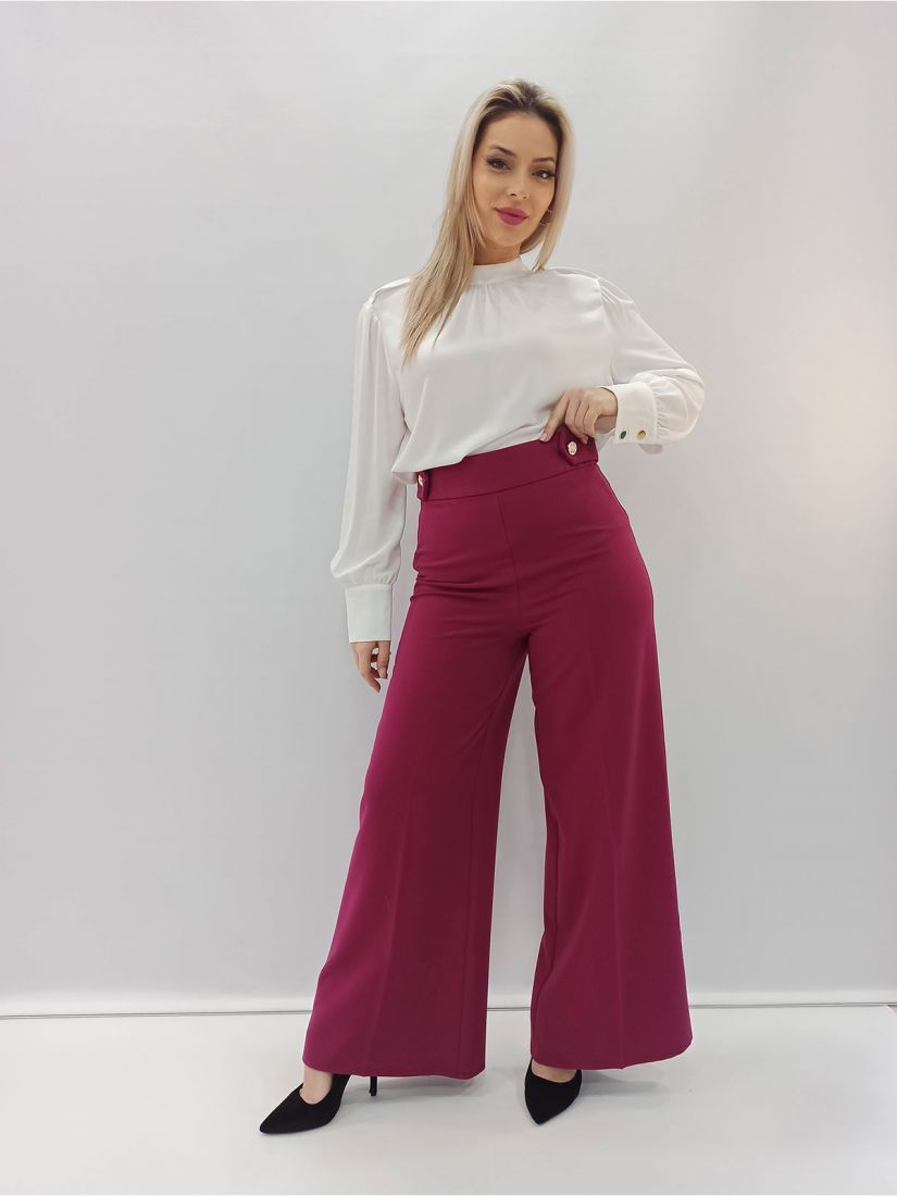 Παντελόνα καμπάνα ψηλόμεση μονόχρωμη με χρυσές λεπτομέρειες ελληνικής ραφής ματζέντα