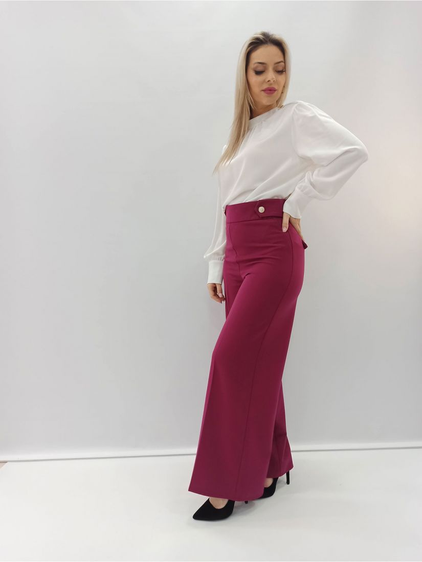 Παντελόνα καμπάνα ψηλόμεση μονόχρωμη με χρυσές λεπτομέρειες ελληνικής ραφής ματζέντα