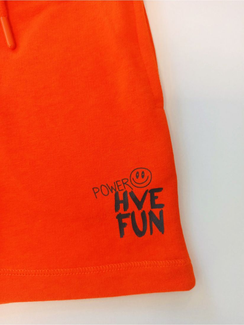 Βερμούδα βαμβακερή μονόχρωμη με λάστιχο στη μέση και τσέπες πορτοκαλί