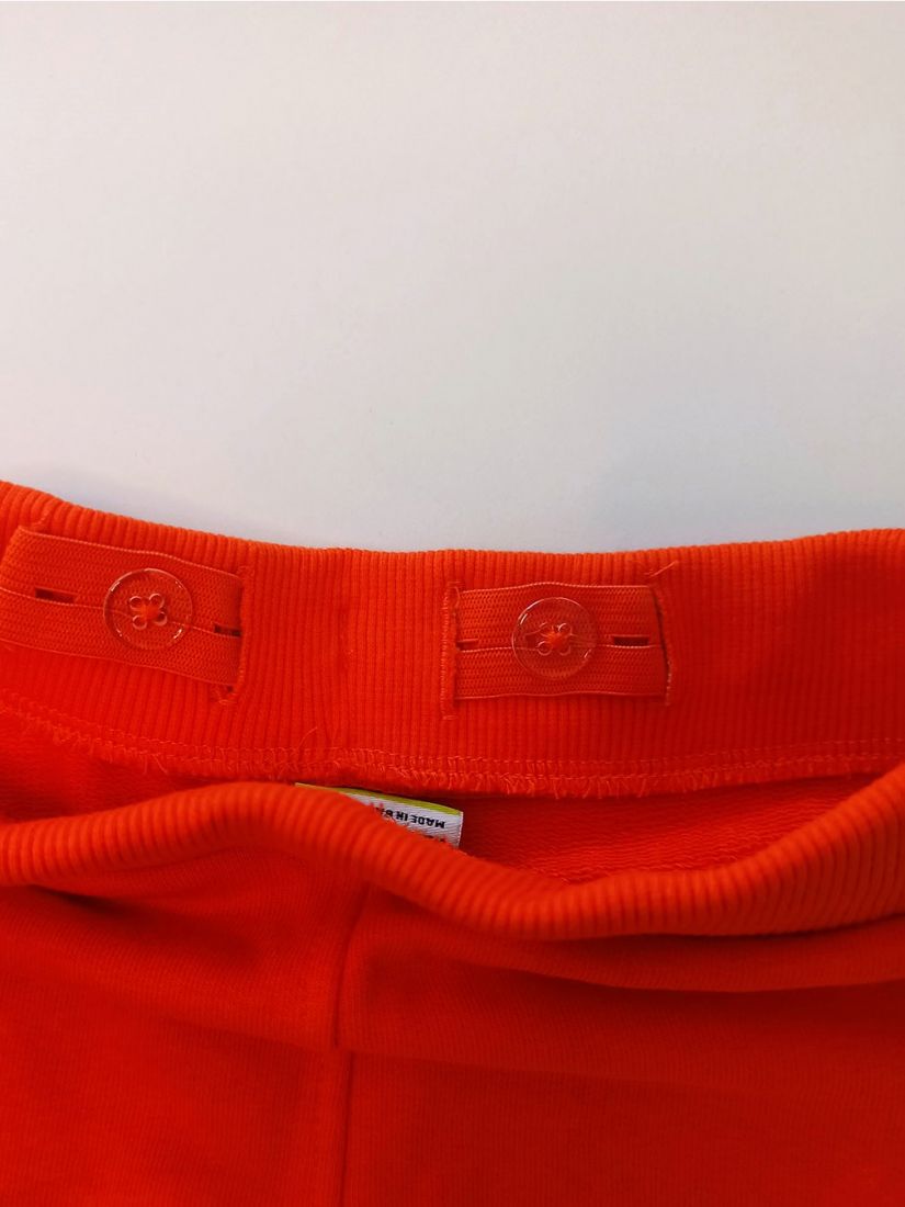 Βερμούδα βαμβακερή μονόχρωμη με λάστιχο στη μέση και τσέπες πορτοκαλί