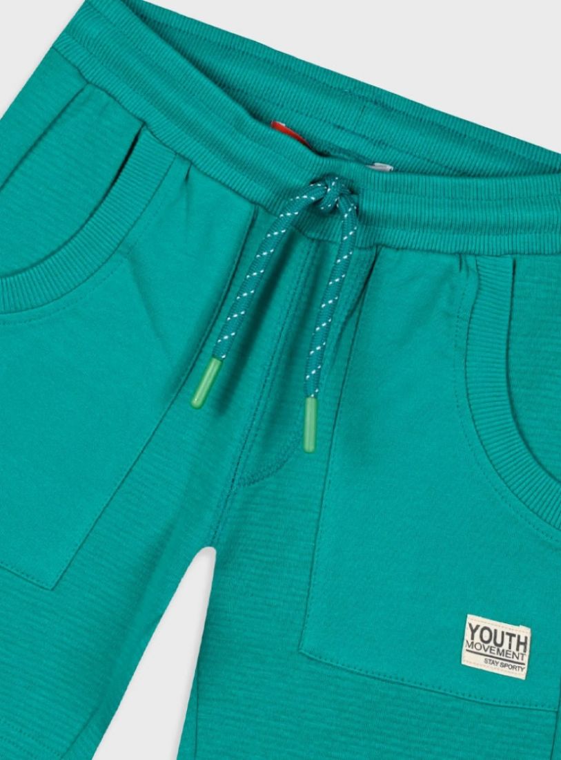 Βερμούδα μονόχρωμη με τσέπες και εφέ ριπ πράσινο