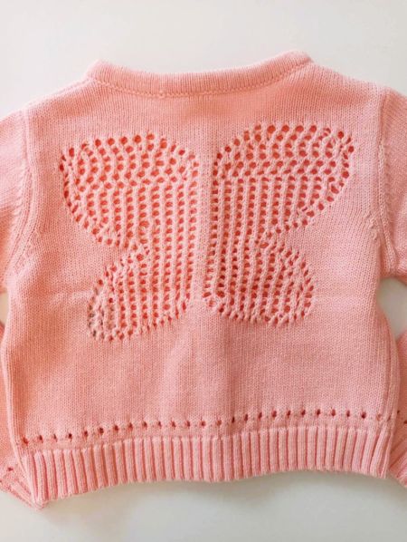 Πλεκτή ζακέτα με πλεκτή πεταλούδα στην πλάτη ροζ
